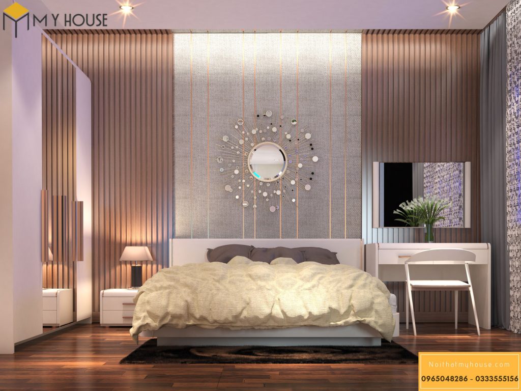 Phòng ngủ master được decor bởi những mảng tường gỗ kết hợp giấy dán