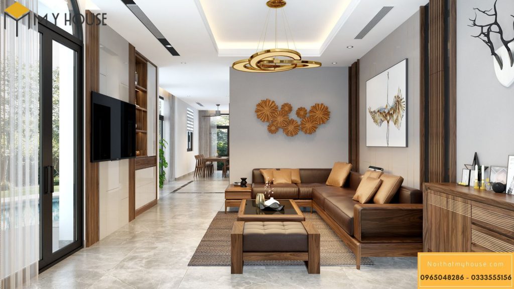Nội thất phòng khách với tông màu đặc trưng của gỗ óc chó và màu vàng đồng của đồ trang trí cao cấp